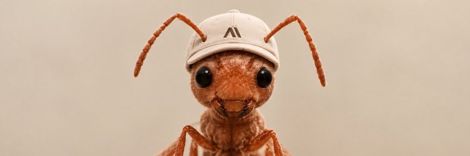 Wide banner of the $ANT mascot ant in its beige cap